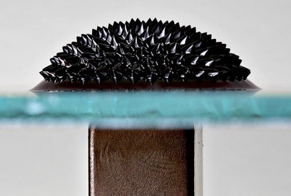 Ferrofluid on glass plate under the influence of a strong magnetic field provided from a magnet below