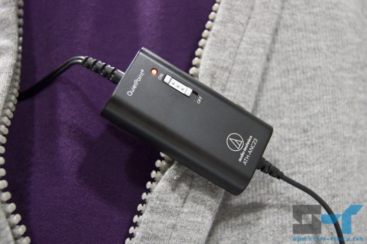Audio-Technica ATH-ANC23 control unit clipped on clothing