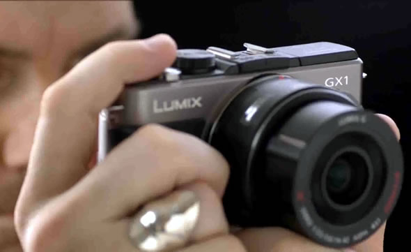 Panasonic Lumix GX1 MFT camera in hand