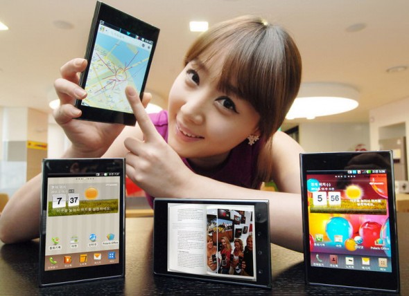 LG Optimus Vu 5.3-inch Android smartphone held by model pointing to maps