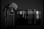 Olympus OM-D E-M5 MFT camera in black side with 12-50mm lens