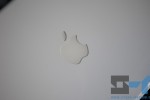 White plastic MacBook - Apple logo close-up