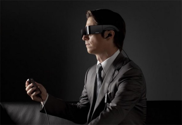 EPSON Moverio BT-100 Android 3D glasses and controller worn by a man