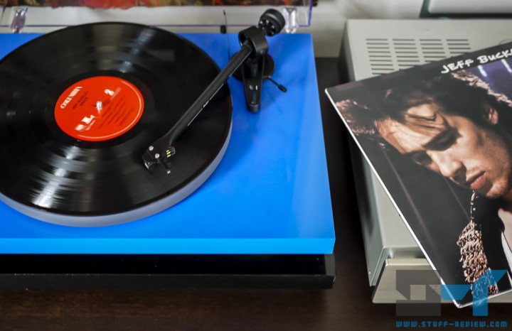 Turntable loaded with vinyl record and album cover