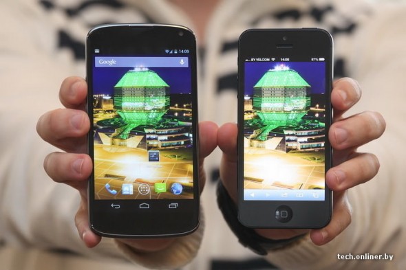 LG Google Nexus vs. iPhone 5 front in hand